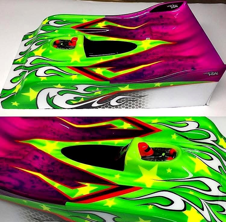 Le Mans style body with fluorescent green, a magenta-to-purple fade, yellow stars and white tribal flames